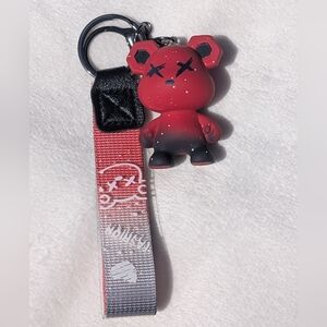 Red and Black gradient bear keychain with white speckles and a matching wristlet